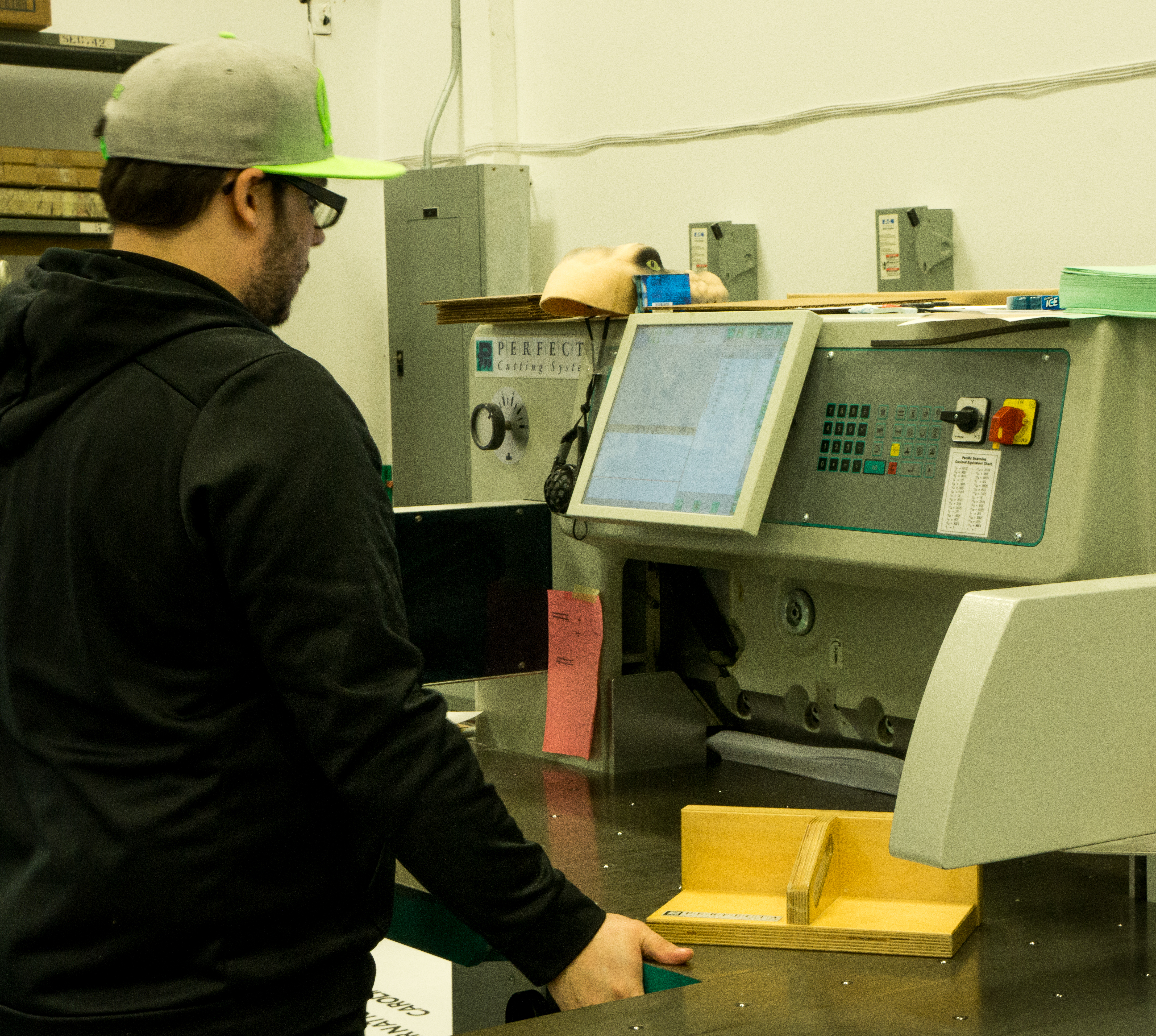 our paper cutter Darryl trimming the book blocks Gorham Printing