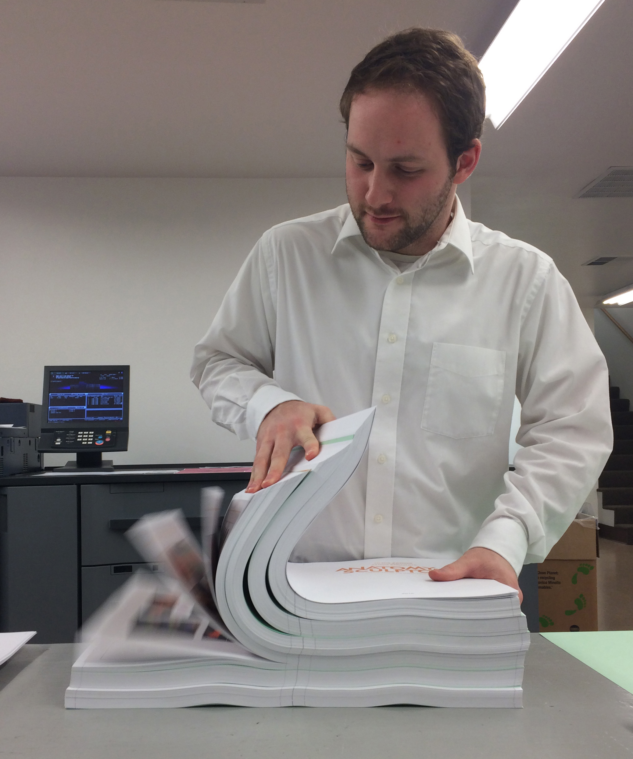 Garrett our production manager checking the paper Gorham Printing