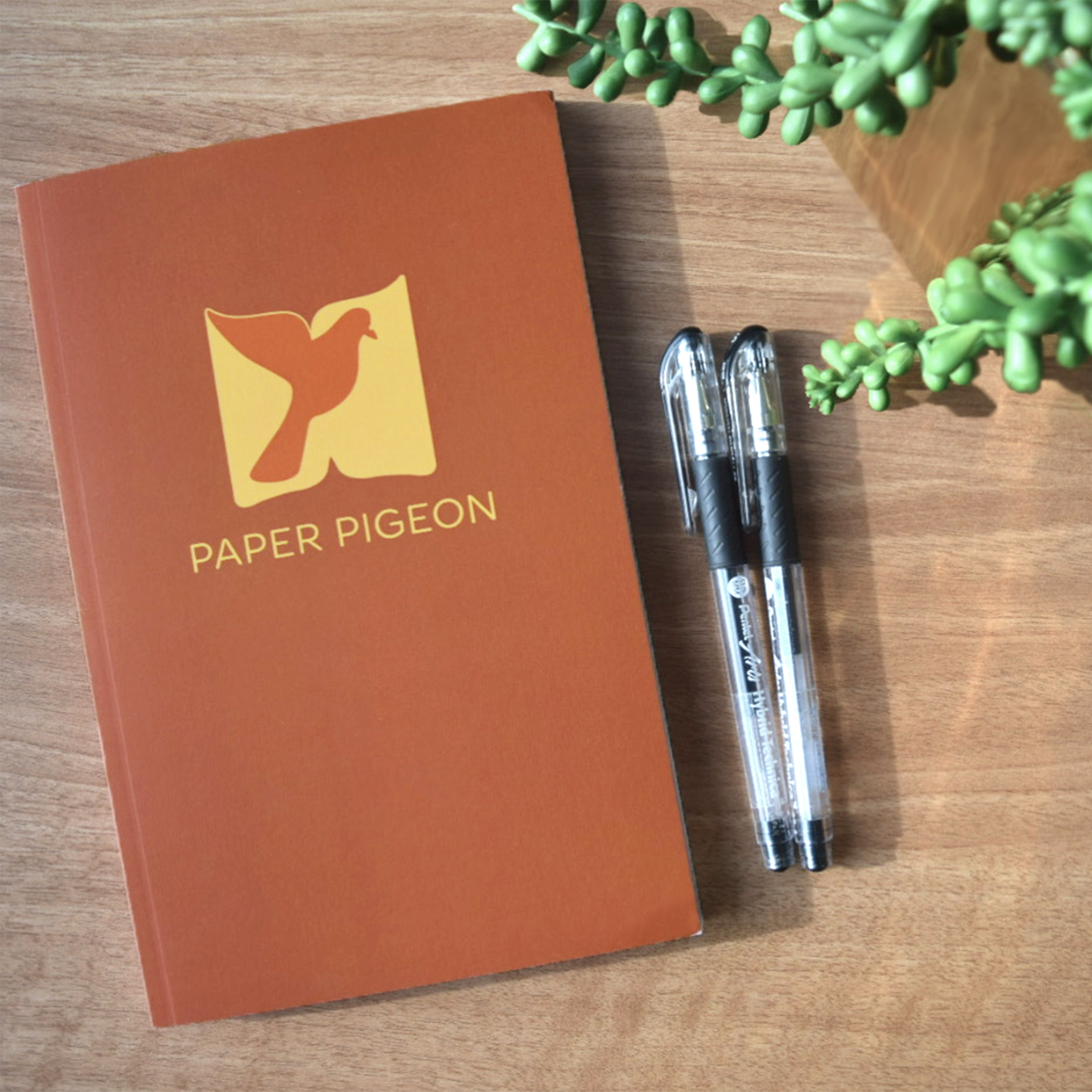 paper pigeon book and pens on the table Gorham Printing