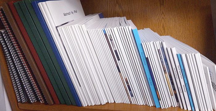 a pile of books and notebooks from Gorham Printing